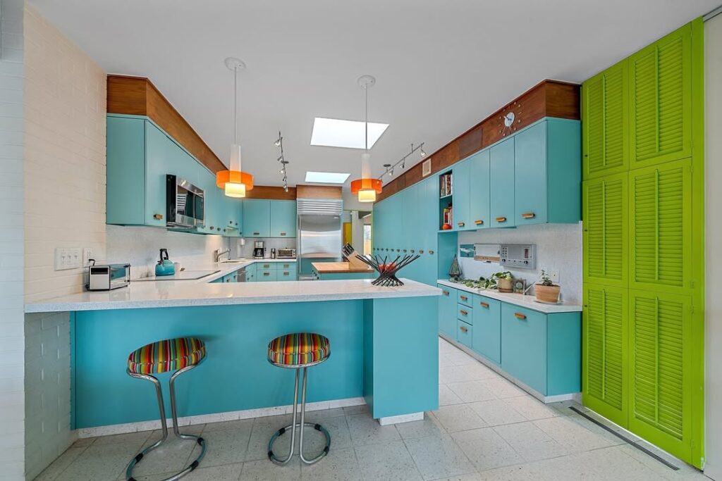  Retro kitchen with turquoise cabinets and orange pendant lights