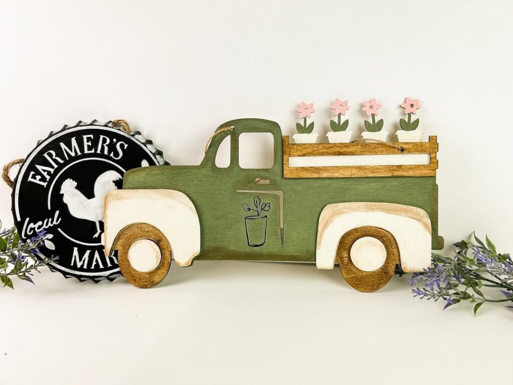 Wooden vintage truck cutout with flower pots and farmers market sign