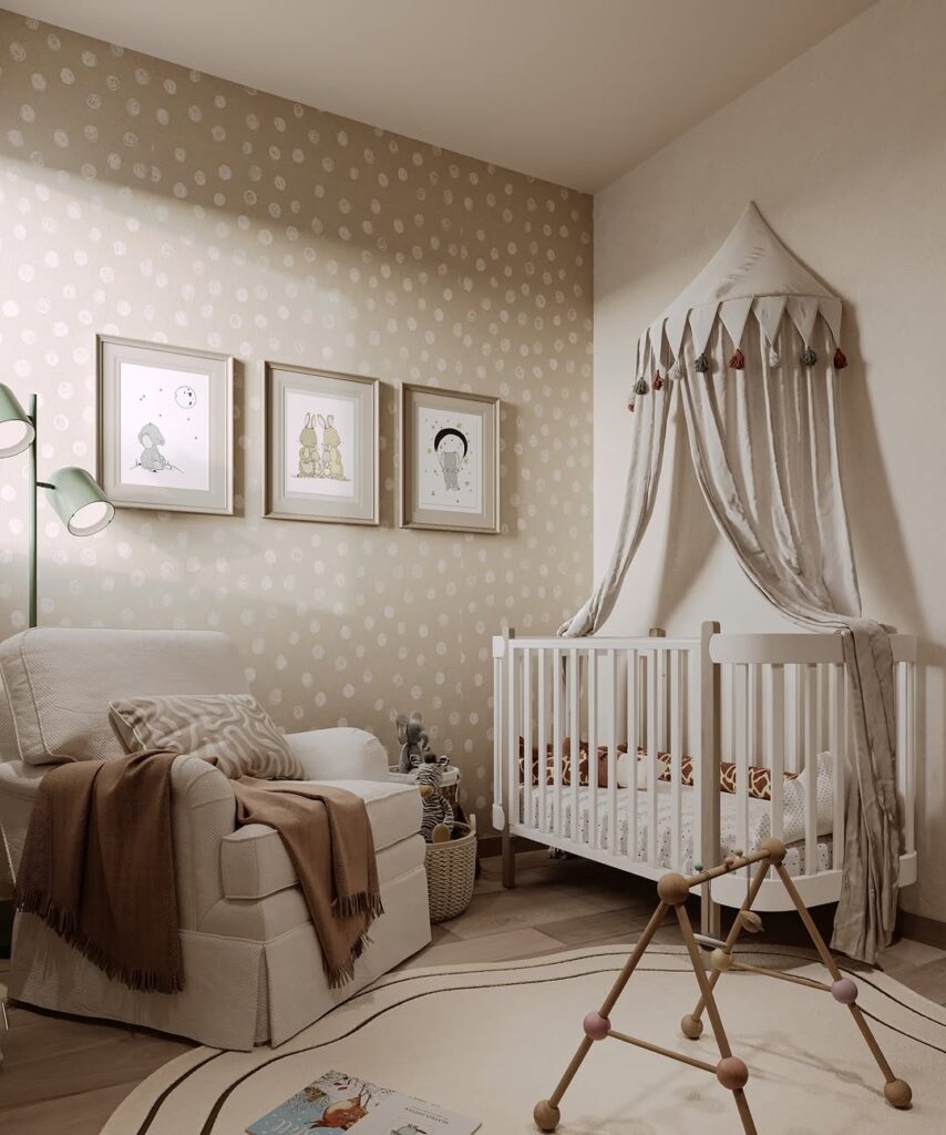 Neutral nursery with polka dot walls canopy and illustrated art