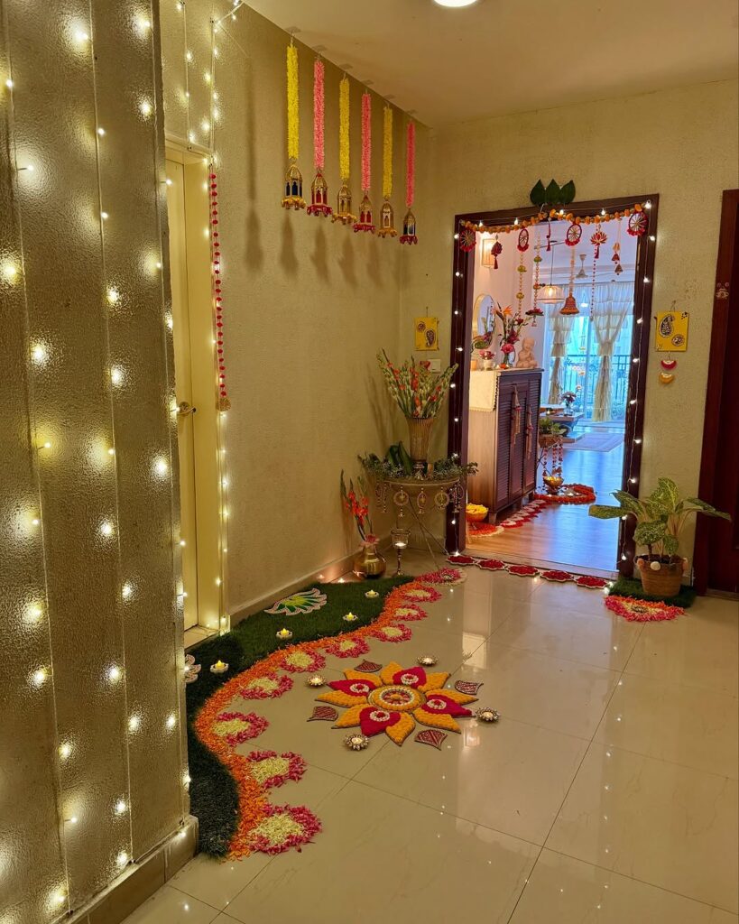  Festive Indian entryway with rangoli design string lights and marigold decorations