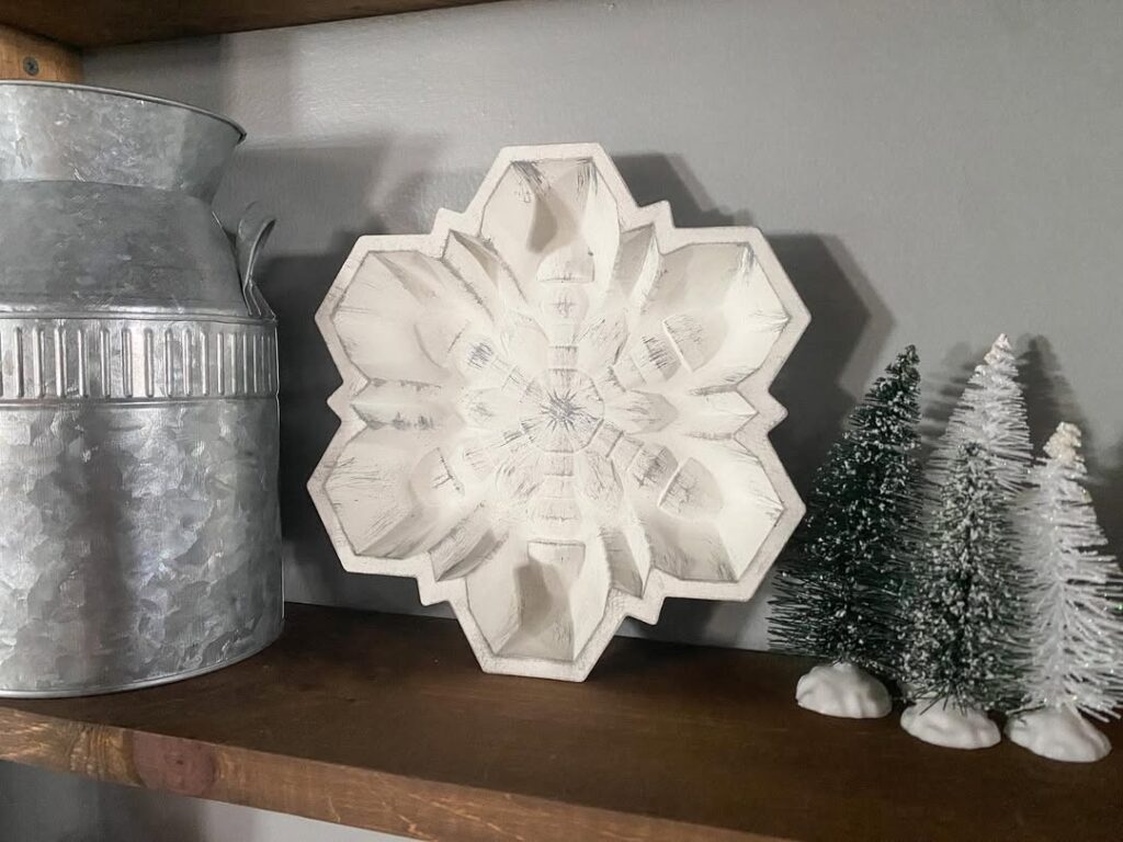  White wooden snowflake decor with galvanized milk can and miniature trees