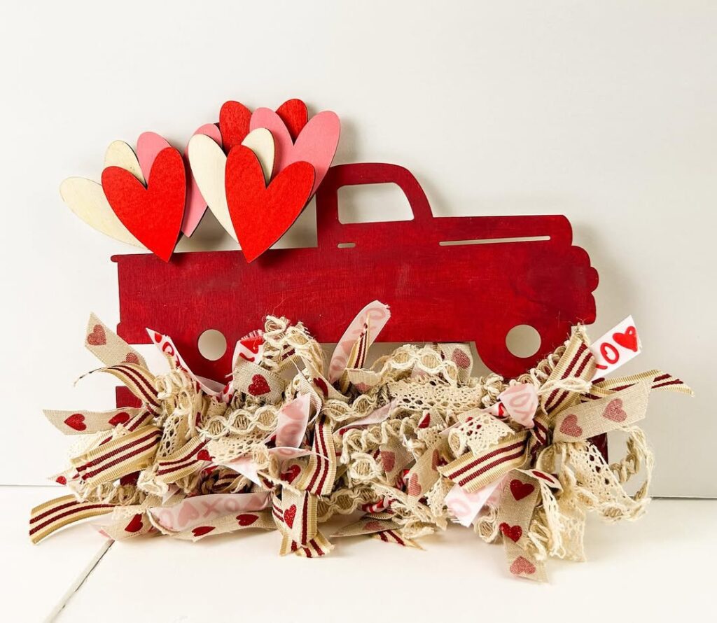 Red wooden truck wall decor with hearts and vintage lace trim