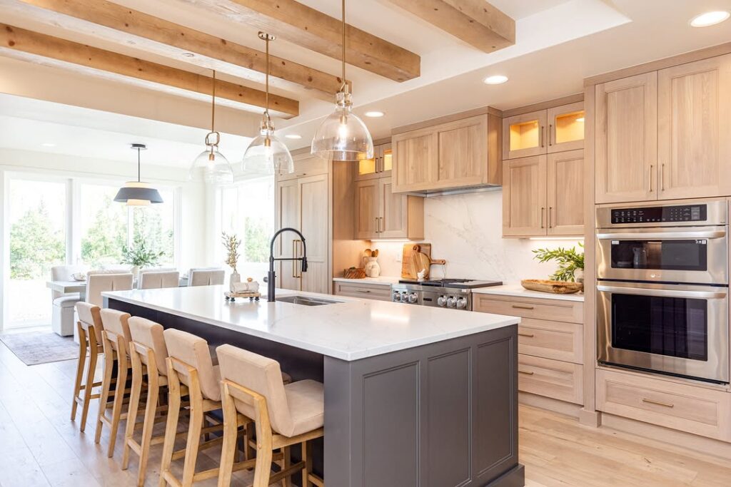 Kitchen with wooden beams and glass pendant lights