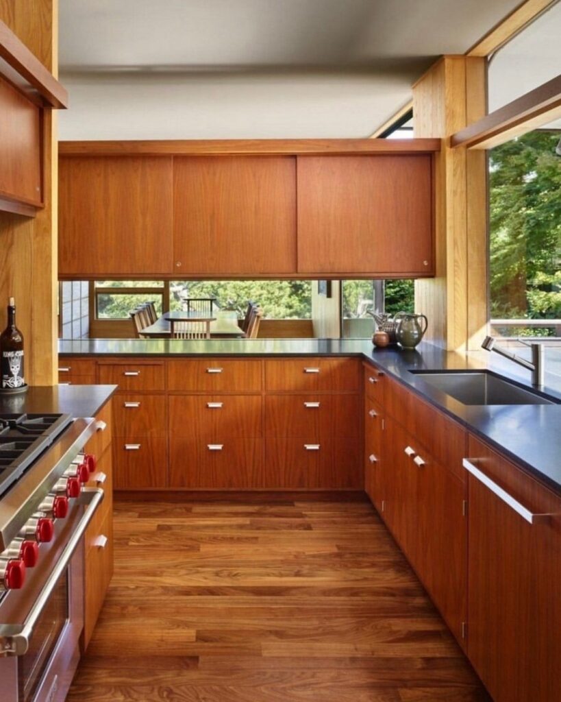 Modern kitchen with walnut cabinets and window detail