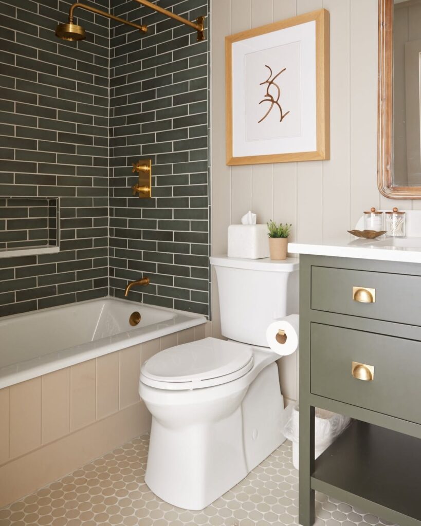 Bathroom with green tile and brass hardware featuring modern vanity