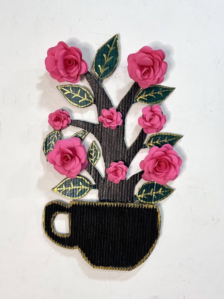 Black teacup wall art with pink paper roses and gold detailed leaves