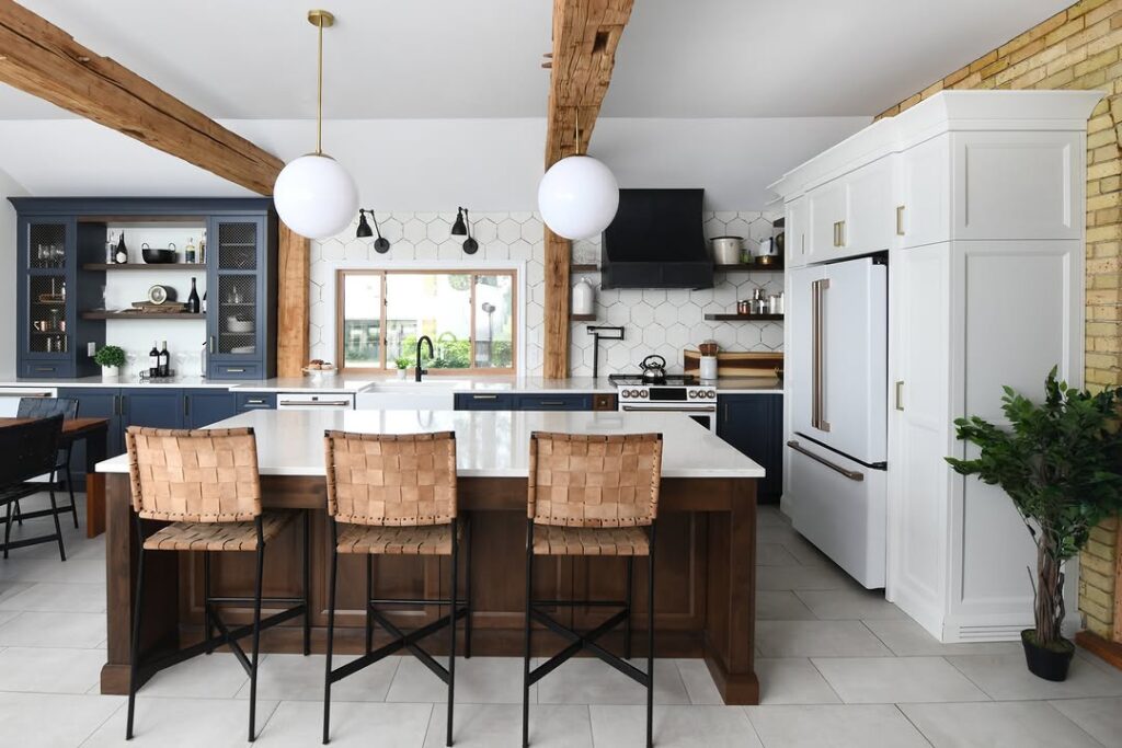 Kitchen with navy cabinets and leather bar stools