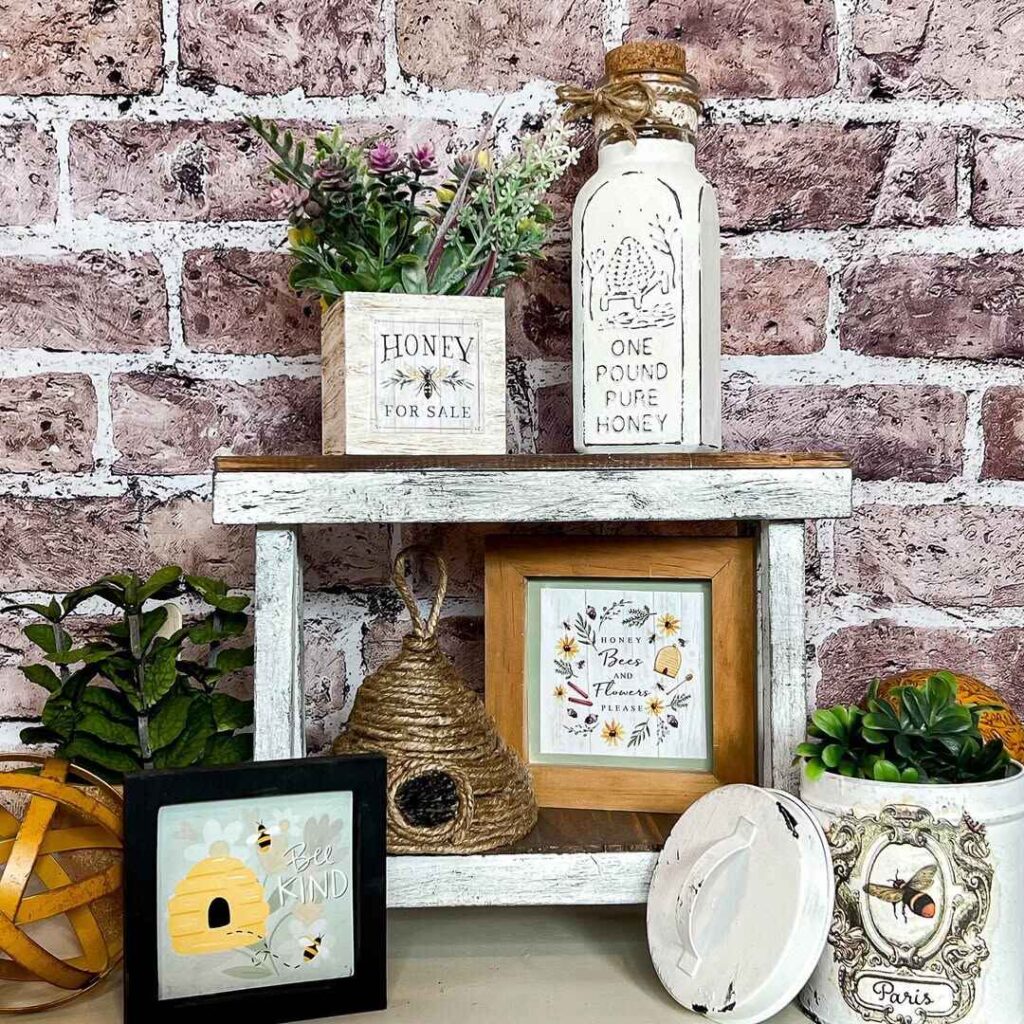 Farmhouse honey bee themed display with vintage bottles and beehive decor