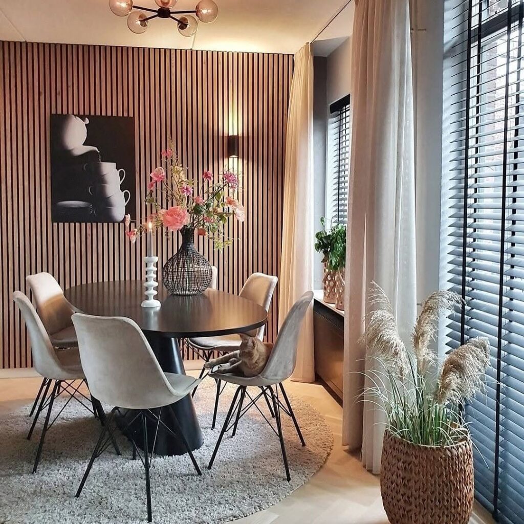 Modern dining room with striped accent wall and contemporary furniture