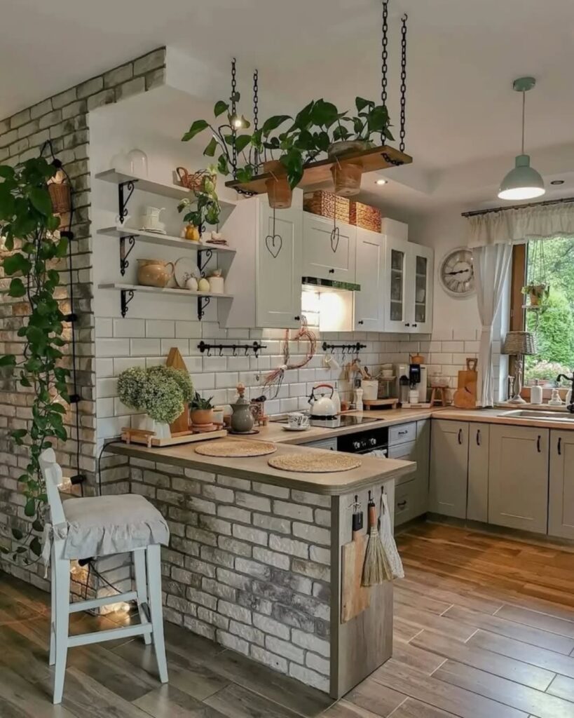 White kitchen with brick wall and hanging plant shelves