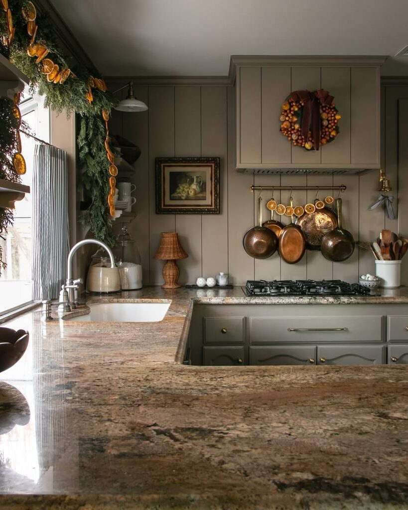 Gray kitchen with copper pans and seasonal decorations