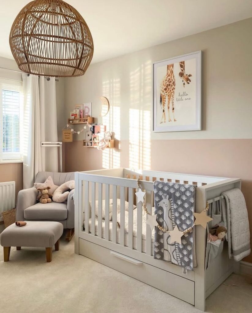 Neutral nursery featuring giraffe artwork rattan pendant light and white crib