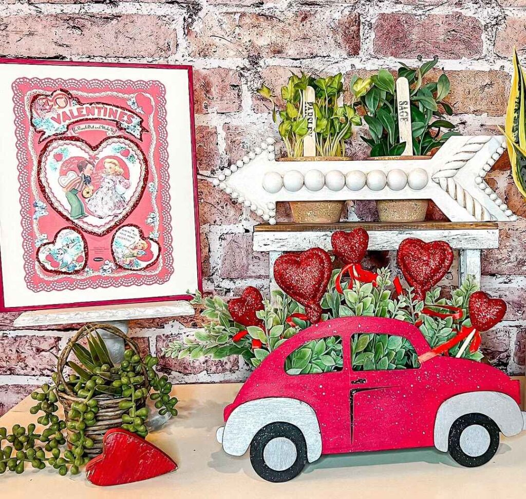 Valentine themed display with vintage card red car and decorative arrow