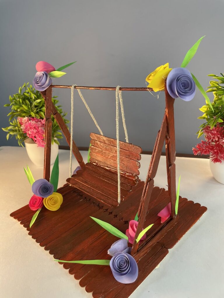  Wooden popsicle stick garden swing with colorful paper flowers