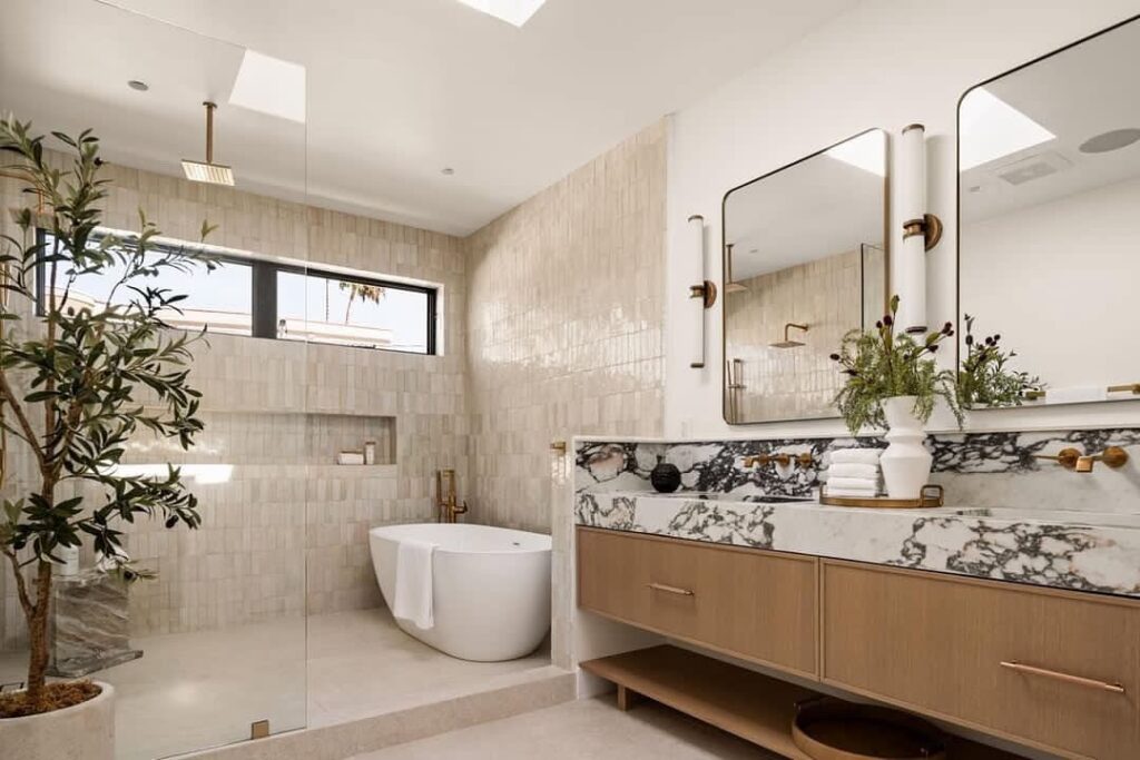 Modern bathroom with cream tiles and floating vanity