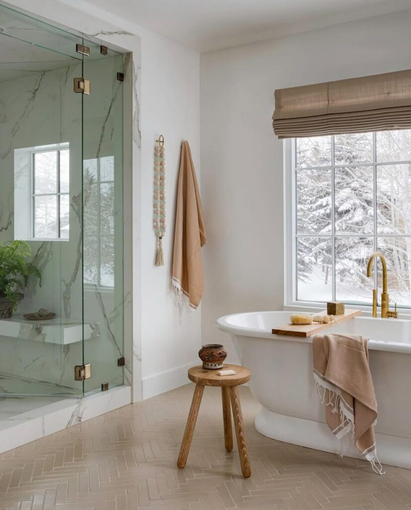  White bathroom with herringbone tiles and winter views