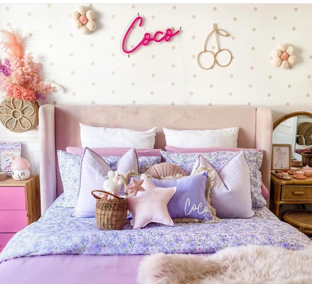 Feminine bedroom with floral bedding and pink vintage inspired decor