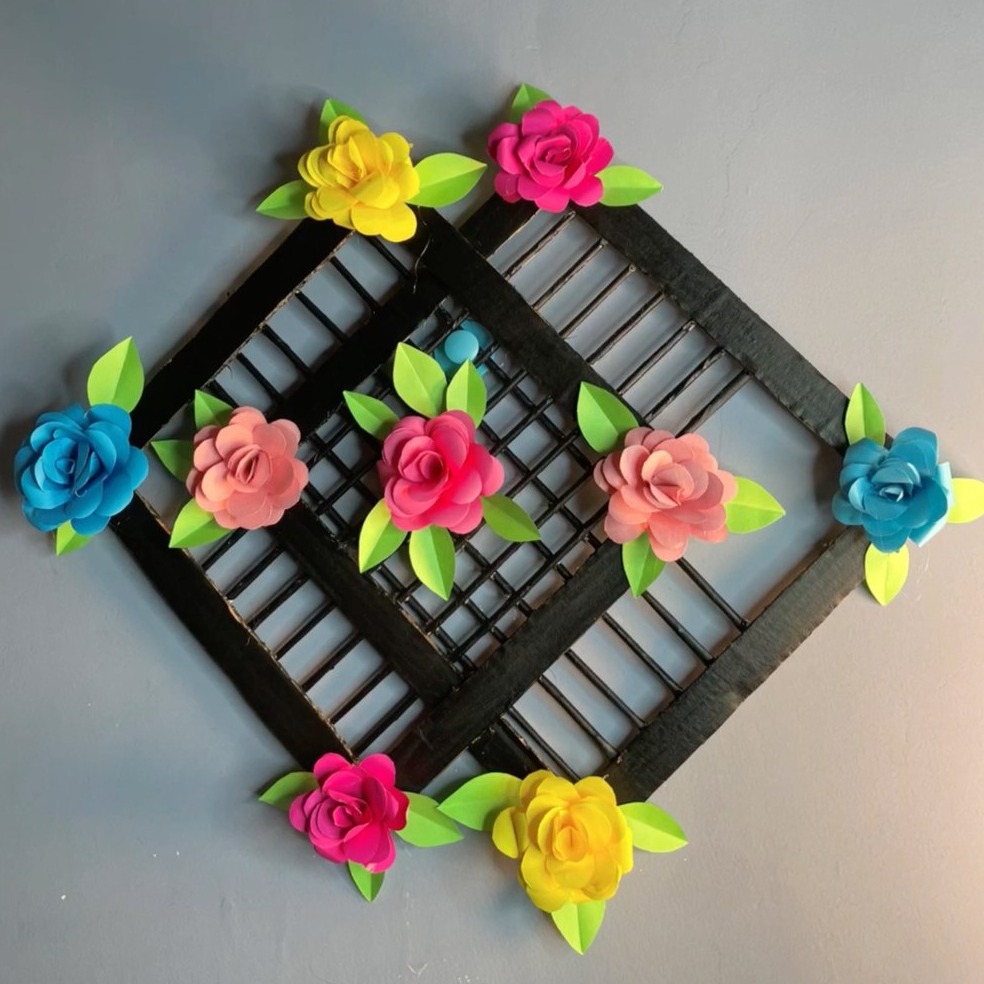 Black diamond lattice frame decorated with colorful paper roses