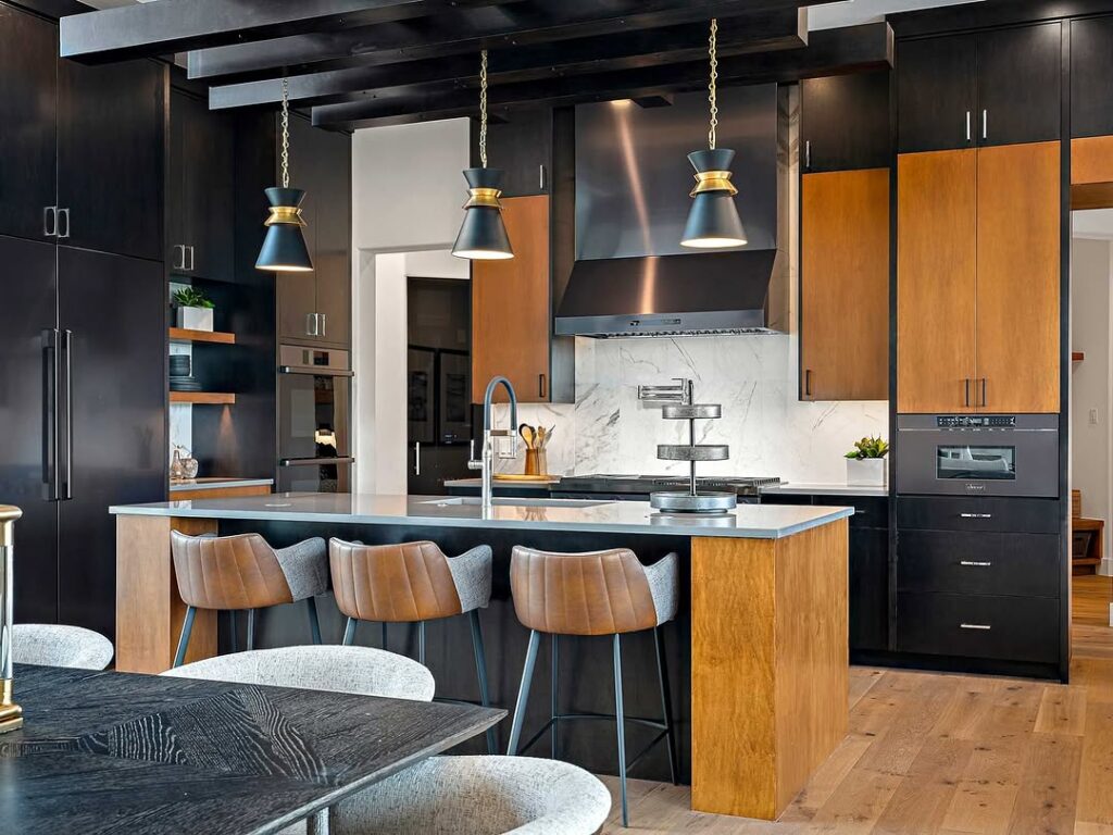 Kitchen with black cabinets leather barstools and wood accents