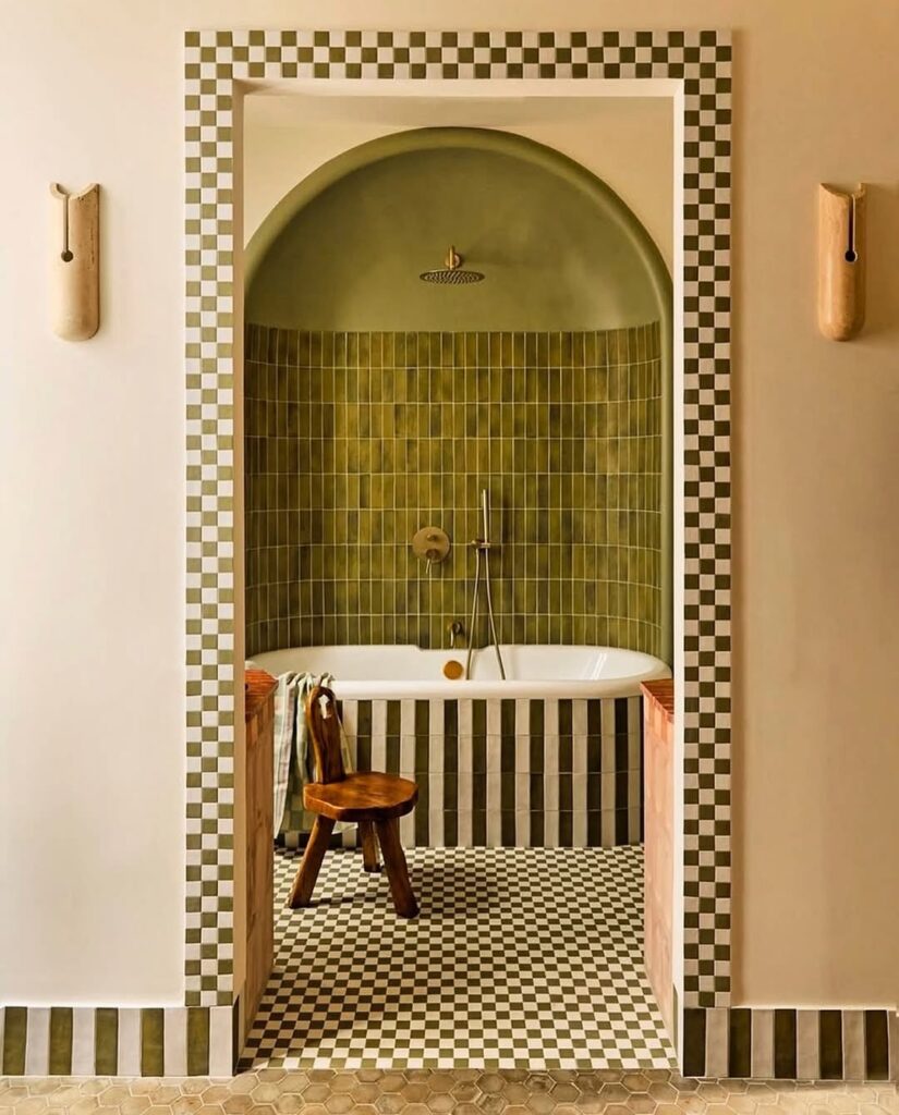 Vintage bathroom with green tiles and checkerboard floor