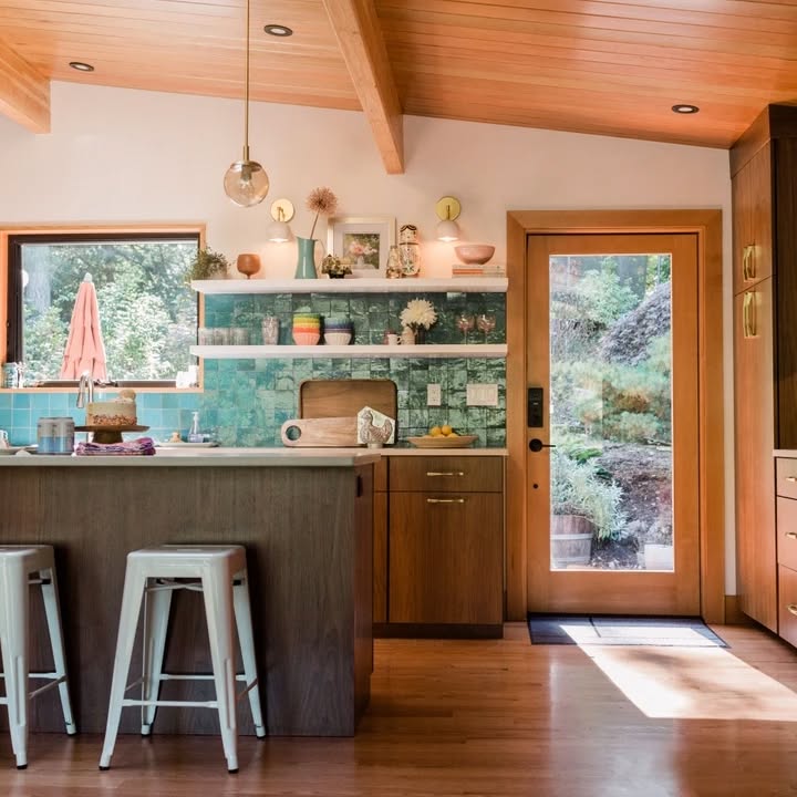 Kitchen with wooden ceiling and turquoise tile backsplash