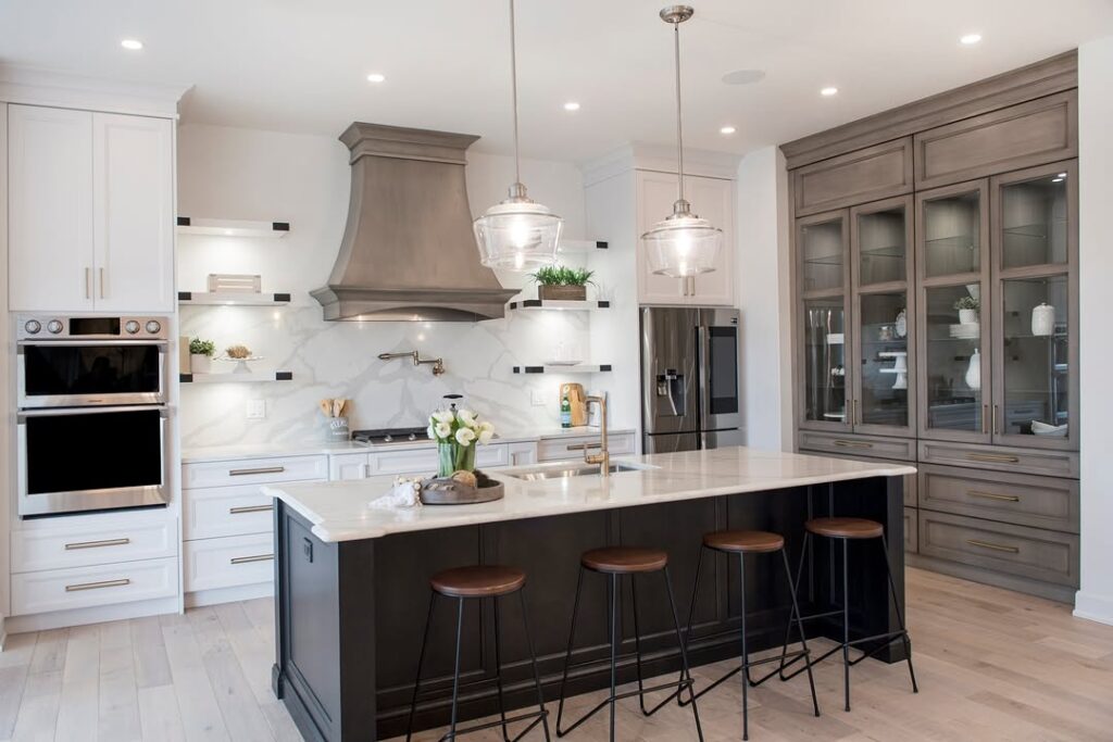 Transitional kitchen with white cabinets and gray accents