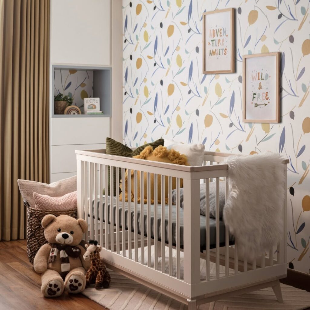  Nursery with leaf wallpaper white crib teddy bear and adventure themed art