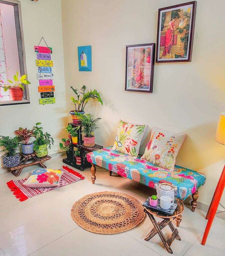 Colorful chaise lounge with tropical cushions and potted plants arrangement