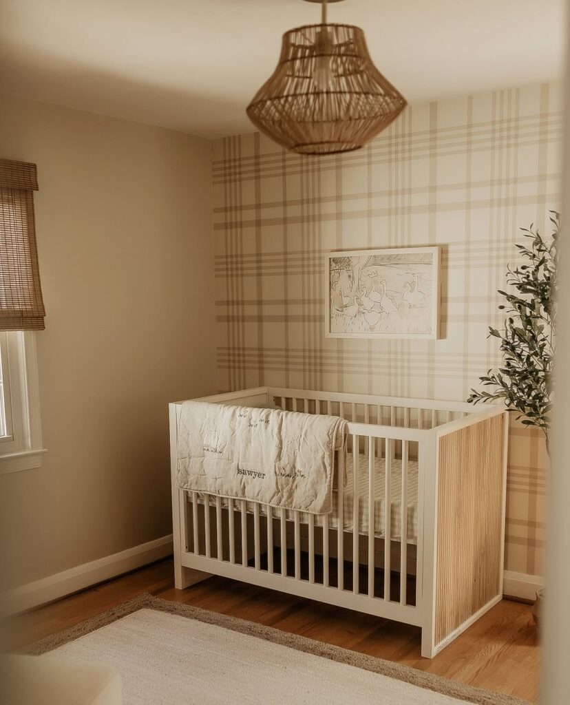 Neutral nursery with plaid walls and rattan pendant light