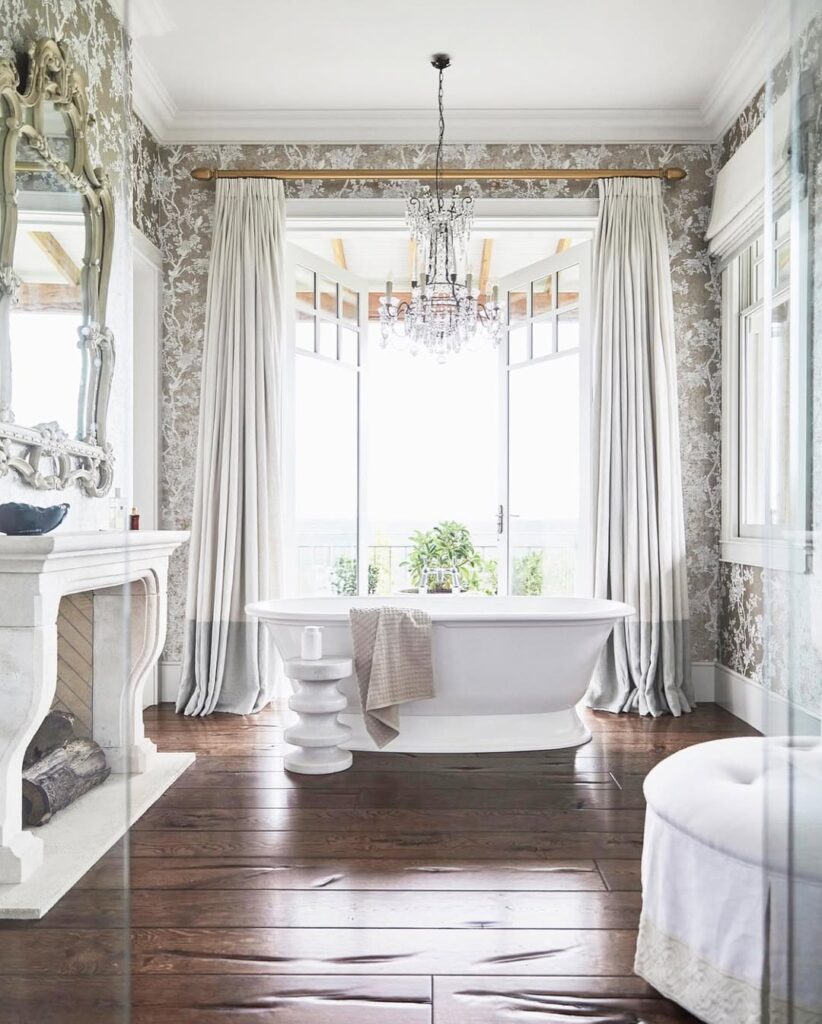 Elegant bathroom with bay window and crystal chandelier