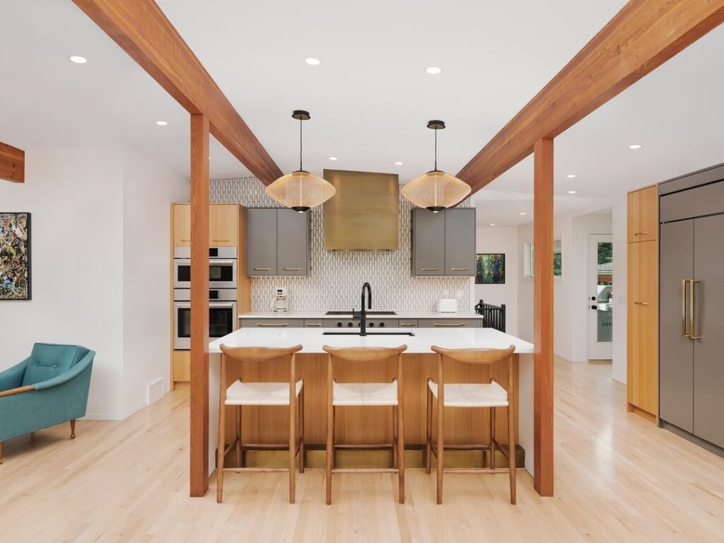 Kitchen with wooden beams and modern pendant lights