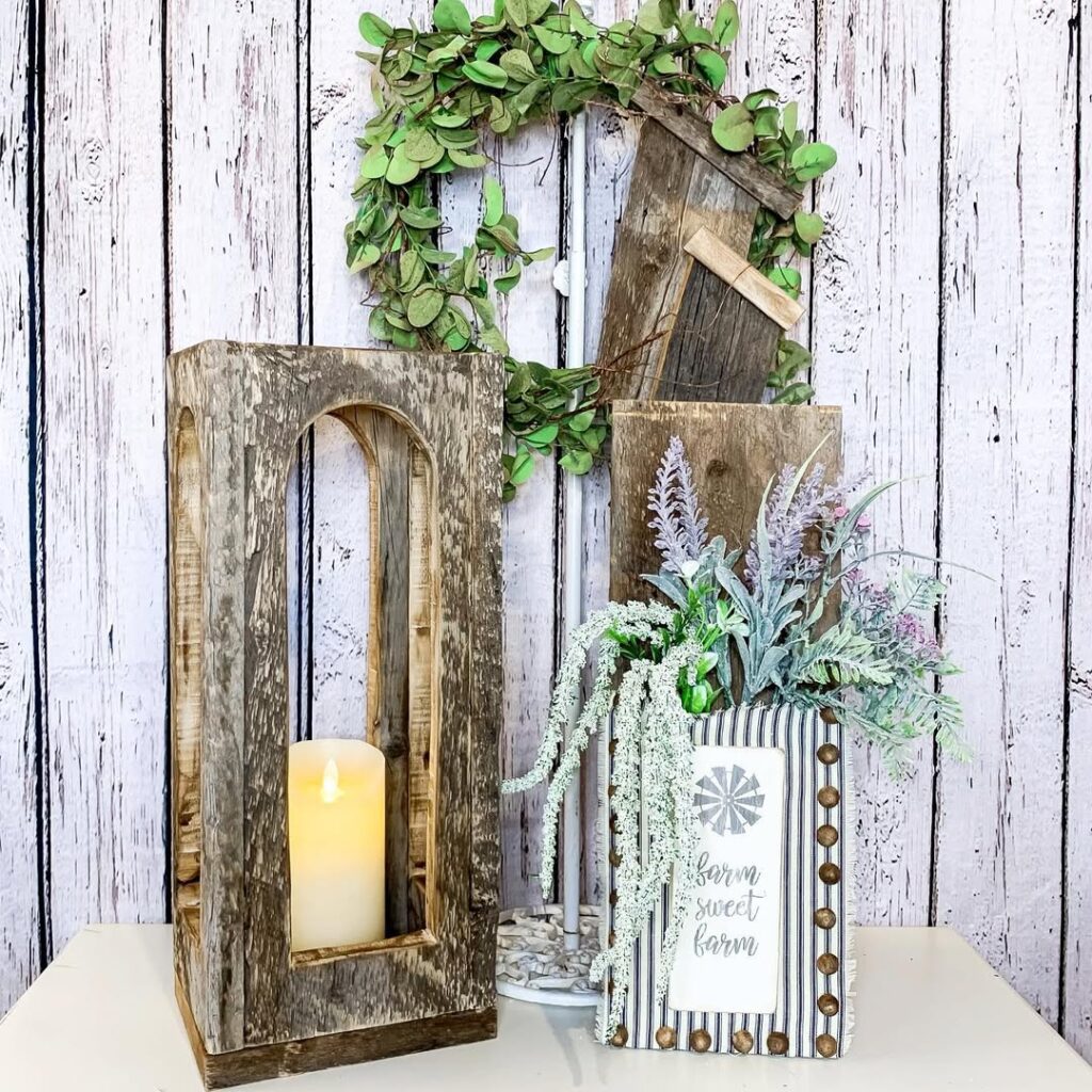 Rustic wooden candle holder with farm sign and greenery wreath