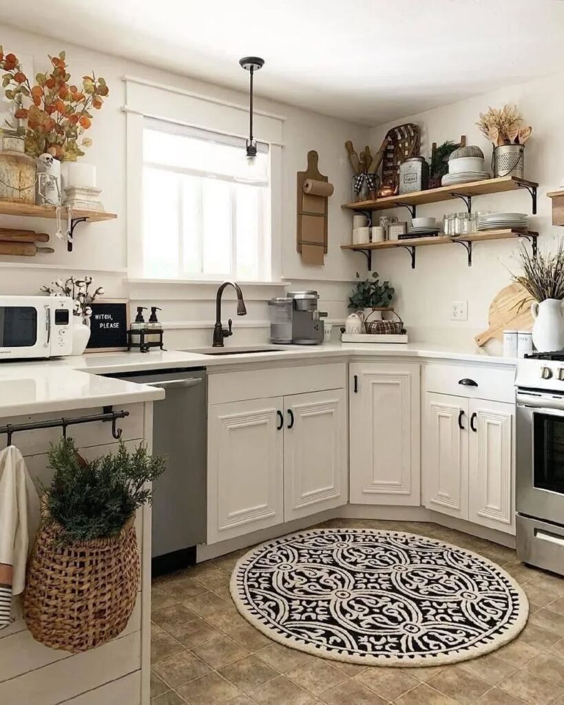 White corner kitchen with open shelves and round patterned rug