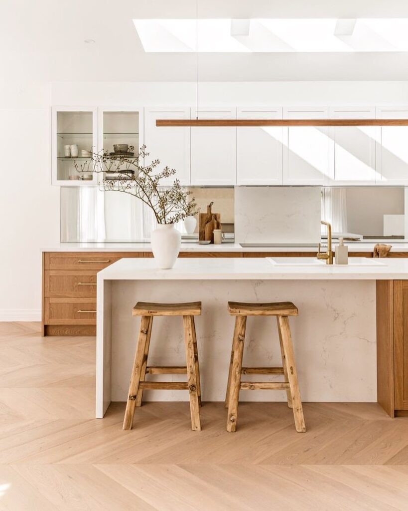 Bright kitchen with marble countertops and wooden accents